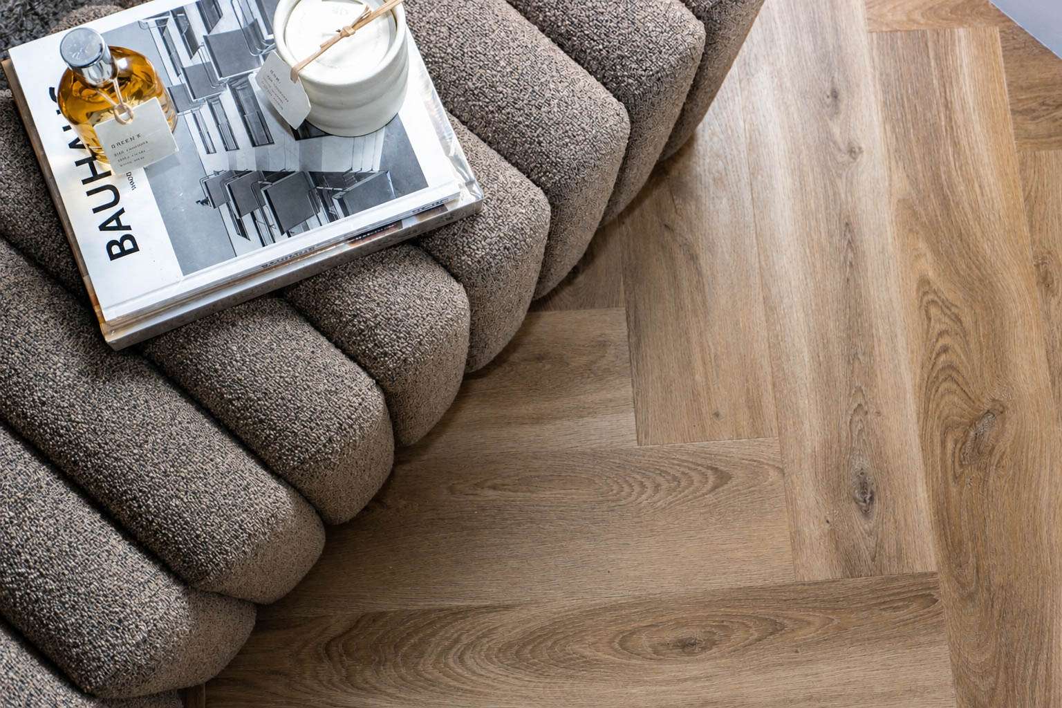 Lattia Piana Auburn Oak — Large Parquet — Bouclé sofa edge, Bauhaus on the seat