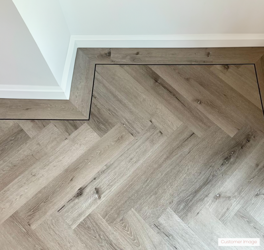 Lattia Vantaa Weimaraner Oak Herringbone Glue Down LVT Flooring - Flooring Monster